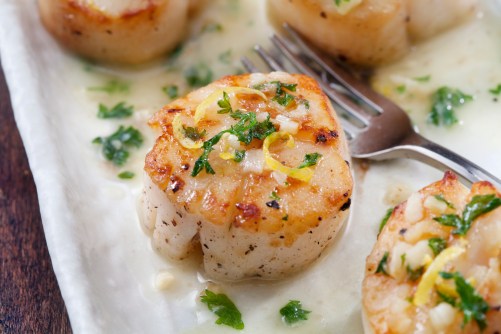Scallops Poached in a Butter and Garlic Sauce